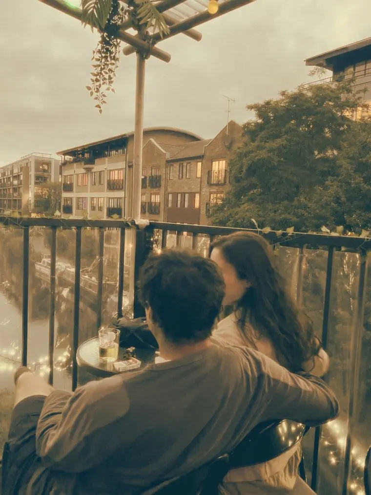 The canal-side terrace looking over the water at dusk